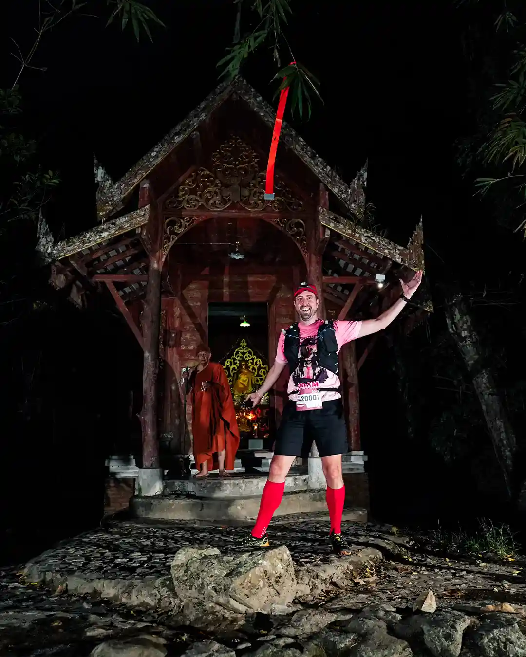 Posing in front of a mini-temple in Mae Kampong